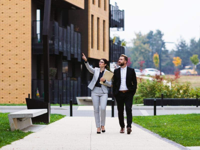 Real estate agent showing properties in Miami.